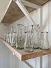 recycled glass, blue-green tinted, handleless milk jugs