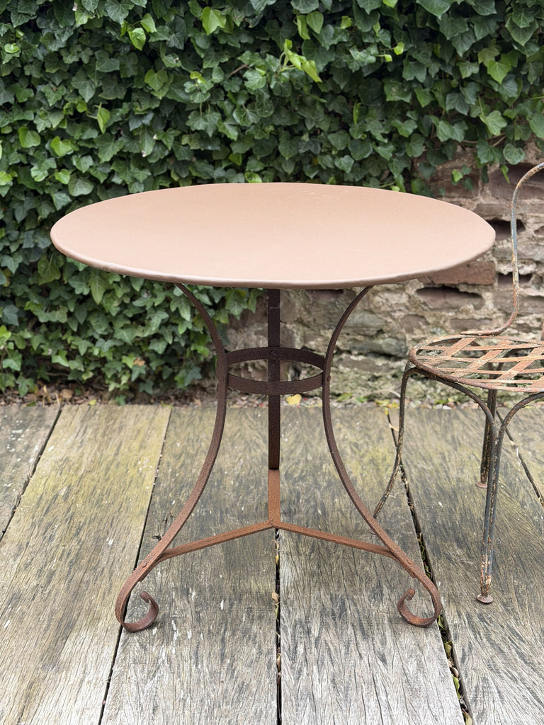 a collection of eight garden tables