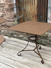 a collection of eight garden tables