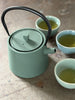 green cast iron teapot