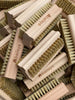 classic, traditional wooden nail brushes. Light coloured natural beech with a baileys logo and natural bristles on each side. One set of bristles are long, the other are short. Ideal for grubby gardeners nails and tinkerers paws.