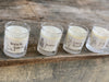baileys glass votive, soy wax candles with paper labels.