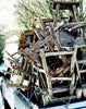 a pile of old elm stools stacked on the back of a truck